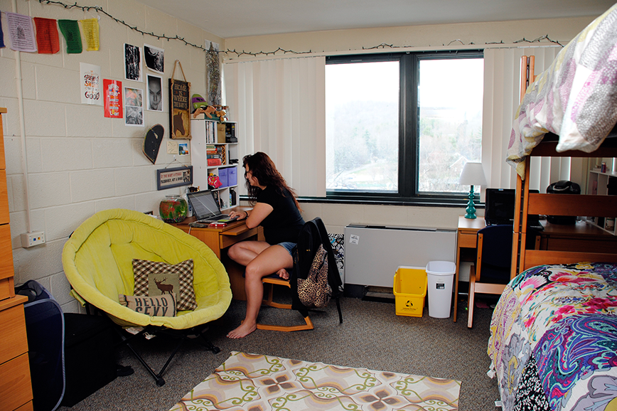 Doughton Hall student sitting at desk in room