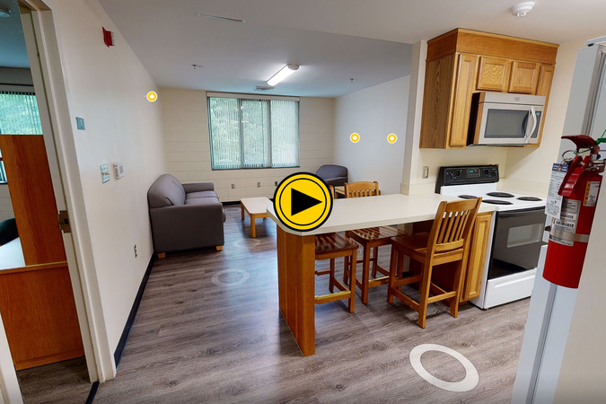 Virtual tour of an Appalachian Heights apartment kitchen and living area.