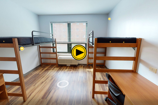 Virtual tour preview of a Laurel Creek Residence Hall double-occupancy room with shared bath, desk, dresser, and bedroom furnishings.