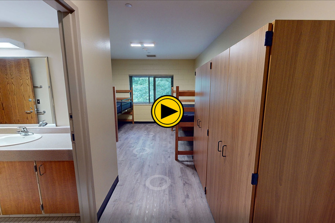 Virtual tour preview of Living Learning Center with beds, furniture and storage.
