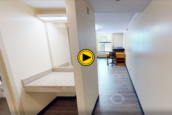 Virtual tour preview of Mountaineer Laurel Hall showing vanity area, desk, bed, storage, and window.