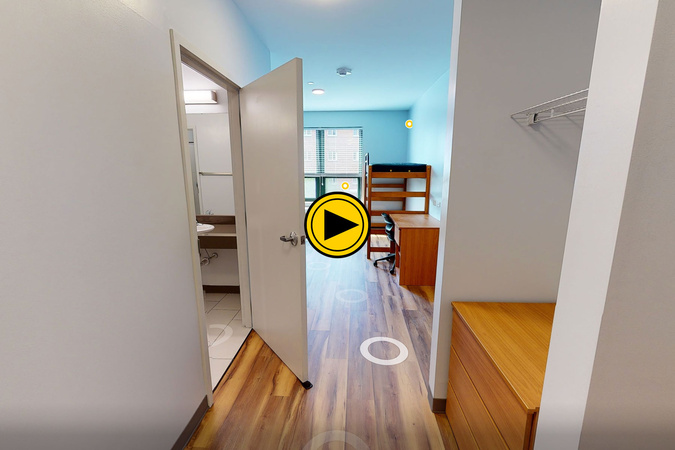 Virtual tour preview of a New River Residence Hall double-occupancy room with shared bath, desk, dresser, and bedroom furnishings.