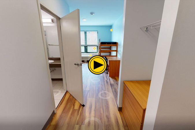 Virtual tour preview of Raven Rocks Hall showing bathroom entrance, desk, bed, storage, and window.